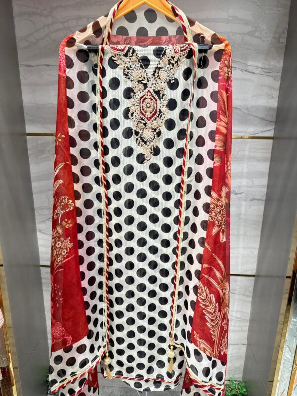 Elegant Pure Organza Polka Dot suit set with floral dupatta.
