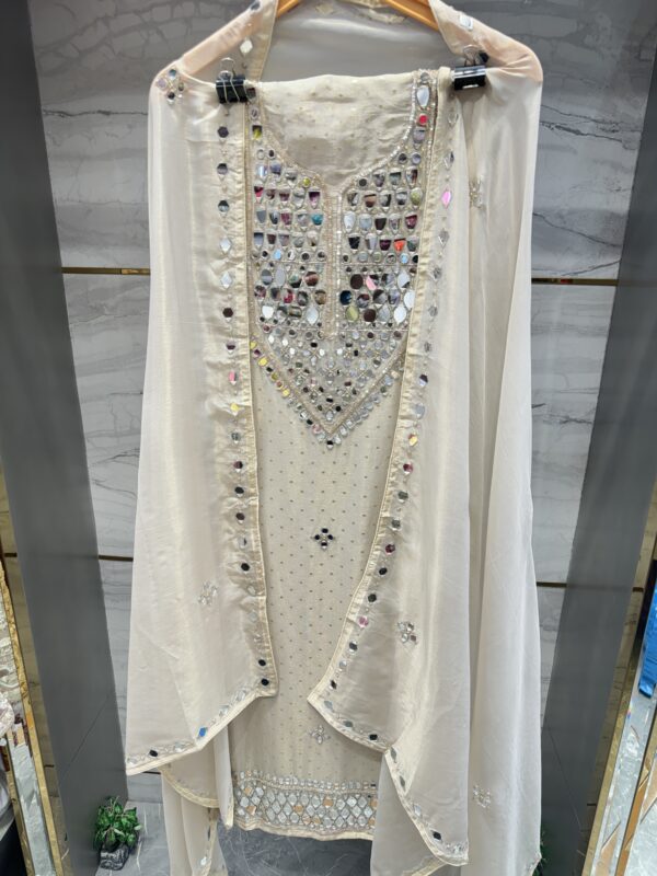 Pure tissue unstitched suit with appealing mirror work