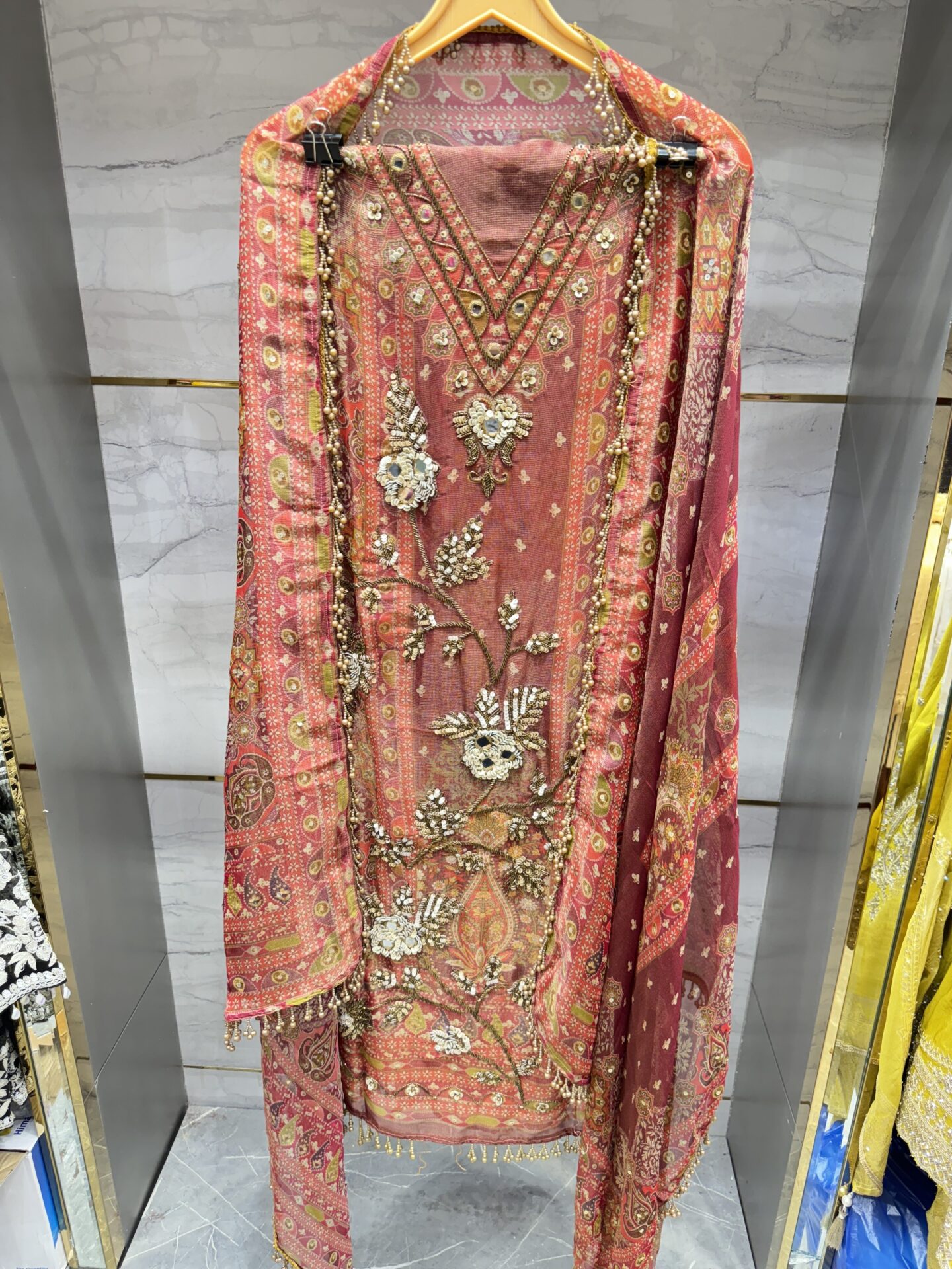 Pure tissue unstitched suit with designer floral embroidery.