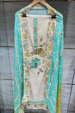 Pure tissue unstitched suit adorned with unique floral embroidery.