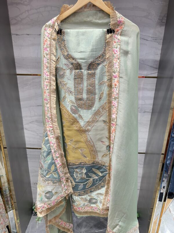 Luxurious tissue fabric with intricate gota floral embroidery.