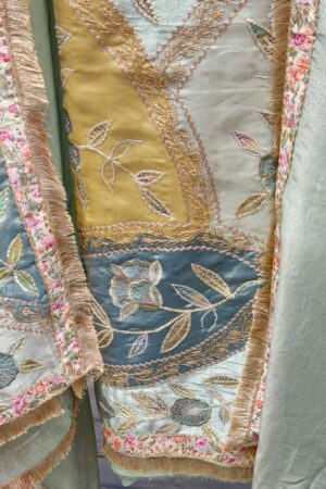 Luxurious tissue fabric with intricate gota floral embroidery.