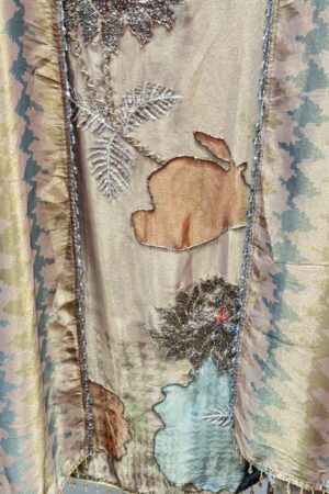 Premium unstitched suit with unique floral embroidery.