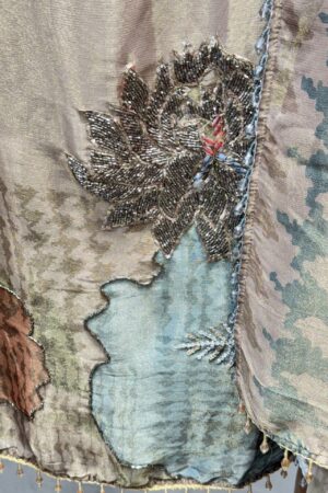 Premium unstitched suit with unique floral embroidery.