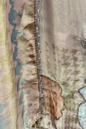 Premium unstitched suit with unique floral embroidery.